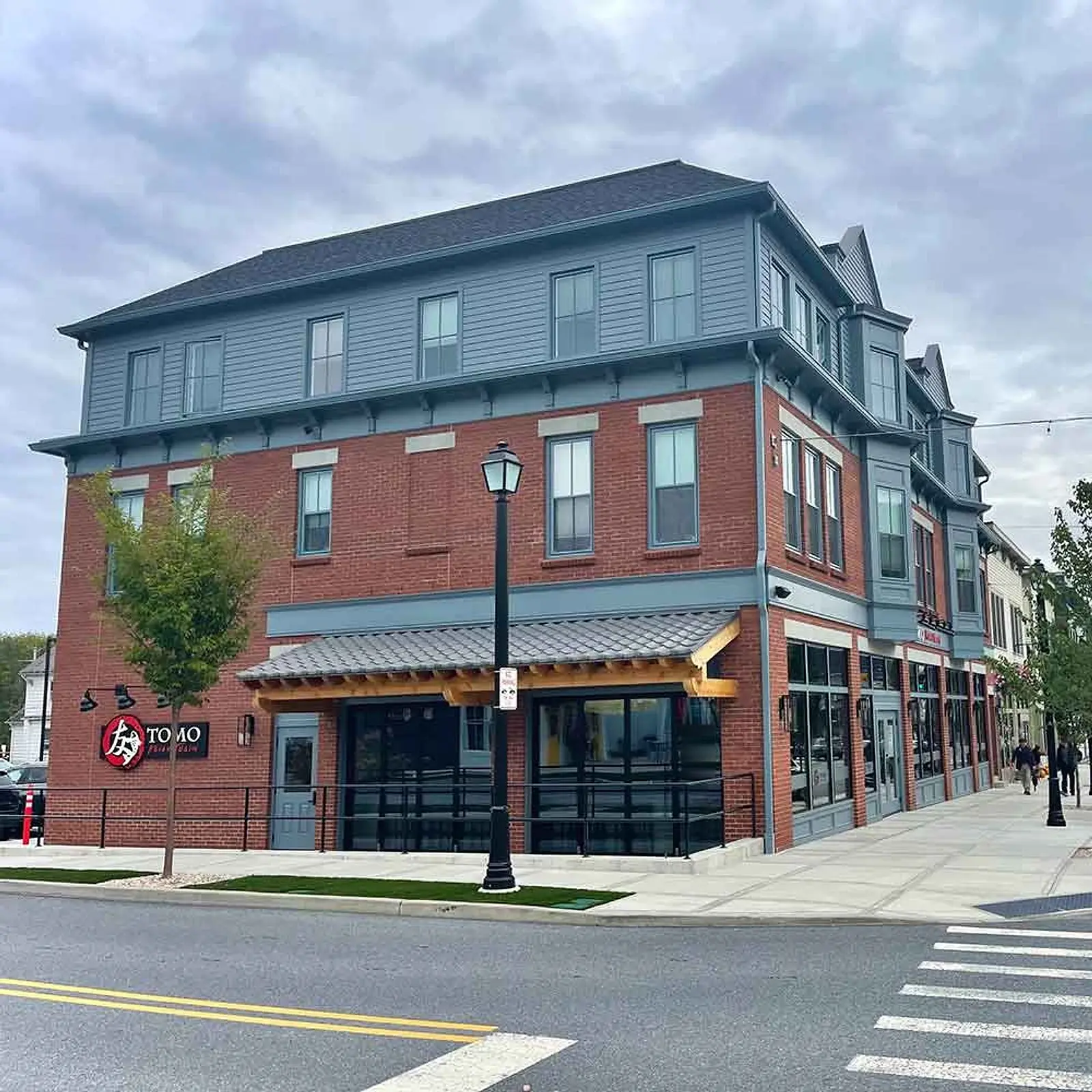 The corner building in Eastdale Village that is home to TOMO Asian Fusion