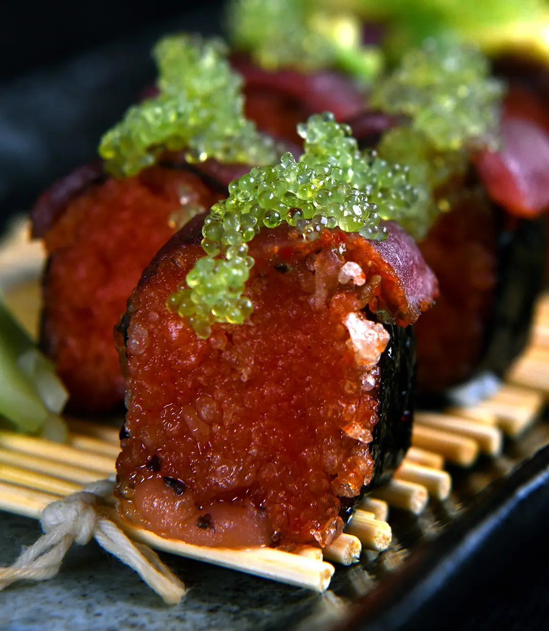 Signature sushi roll topped w/tuna and wasabi tobiko